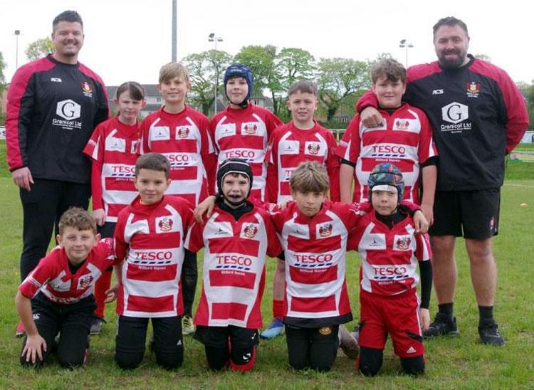 Leigh as junior rugby coach